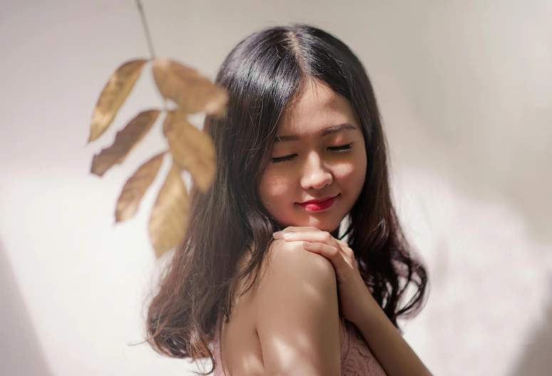 a woman in a pink dress posing for a picture, a picture, inspired by Ruth Jên, trending on pexels, photorealism, leaf hair, her skin is light brown, vietnamese woman, soft backlight