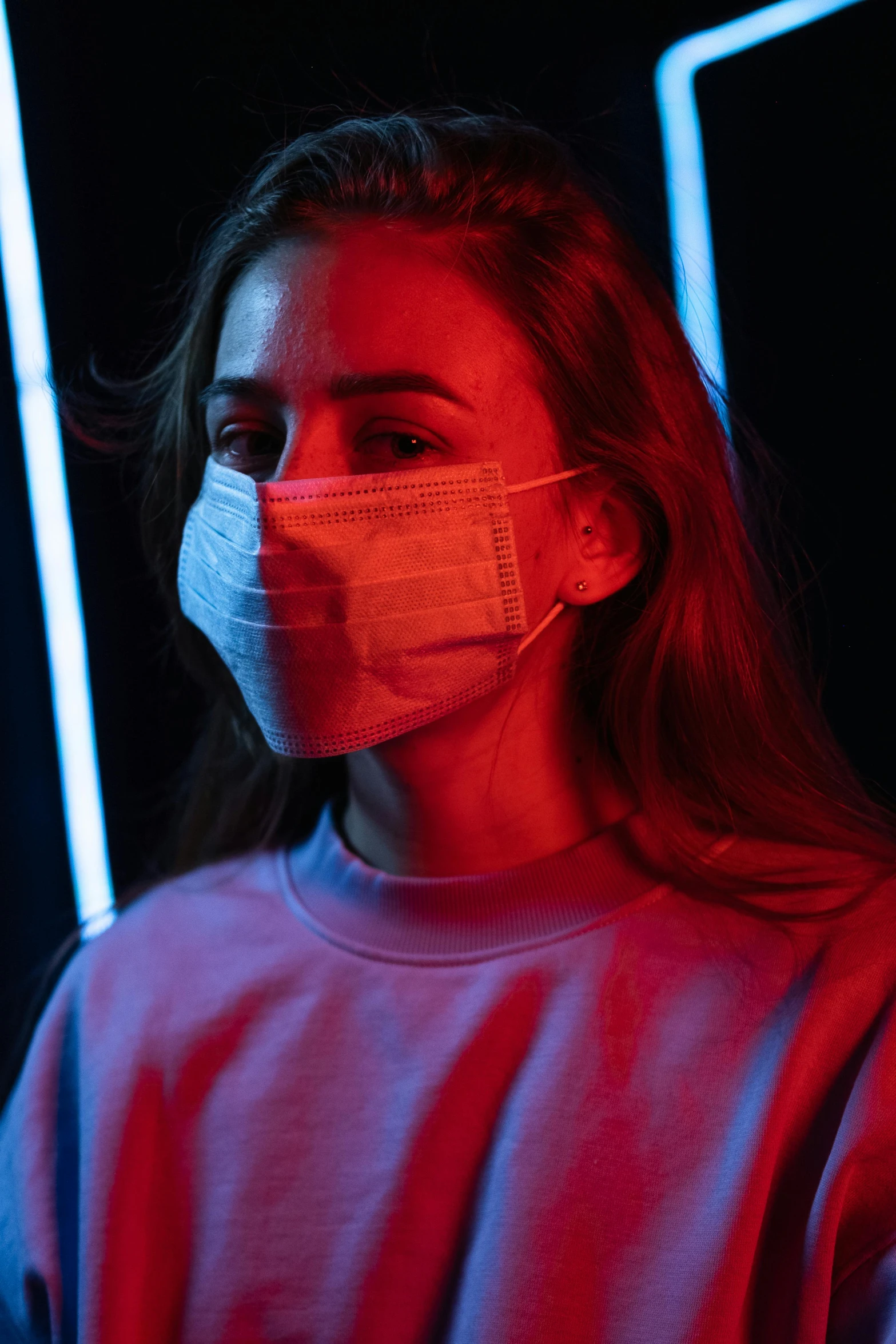 a woman wearing a face mask in the dark, inspired by Elsa Bleda, stood in a lab, teenage girl, soft glow, ( ( mask ) )