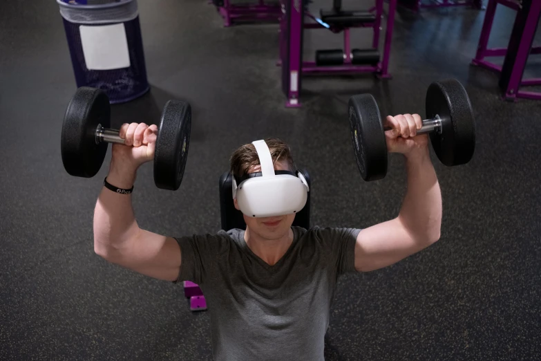 a man is using a vr headset in a gym, a portrait, inspired by An Gyeon, reddit, white and purple, bulky build, top-down shot, lachlan bailey