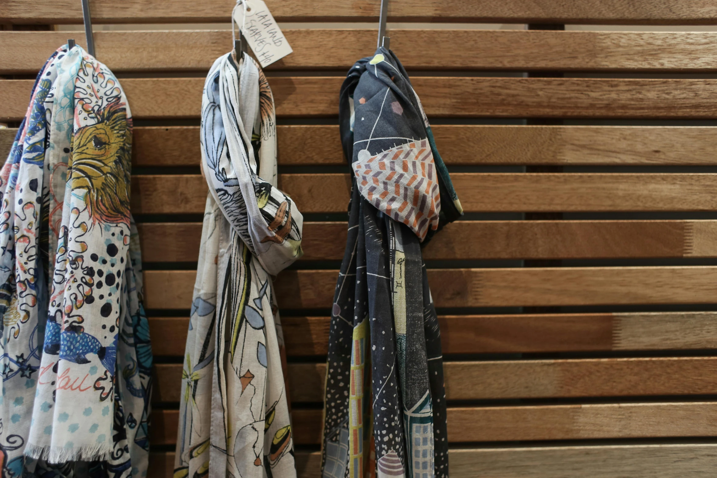 a bunch of ties hanging on a wooden wall, by Lee Loughridge, unsplash, process art, wearing a haori, dress in voile, patterned scarf, botanical