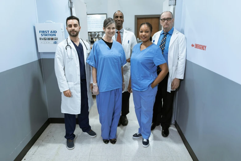 a group of doctors standing next to each other, a portrait, by Dan Luvisi, maintenance photo, jemal shabazz, usa, julia hill