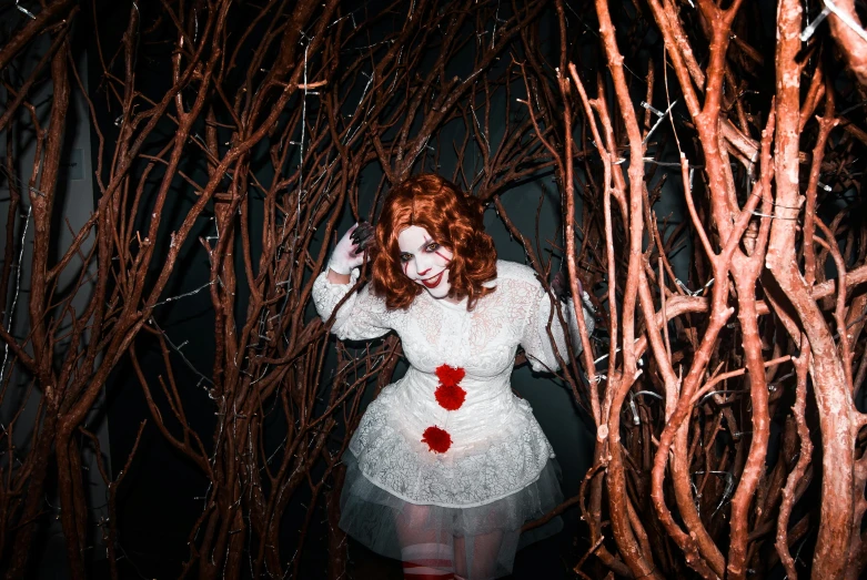 a woman dressed as a zombie in a forest, pexels, renaissance, stephen king as pennywise, inside a haunted house, vines, (night)