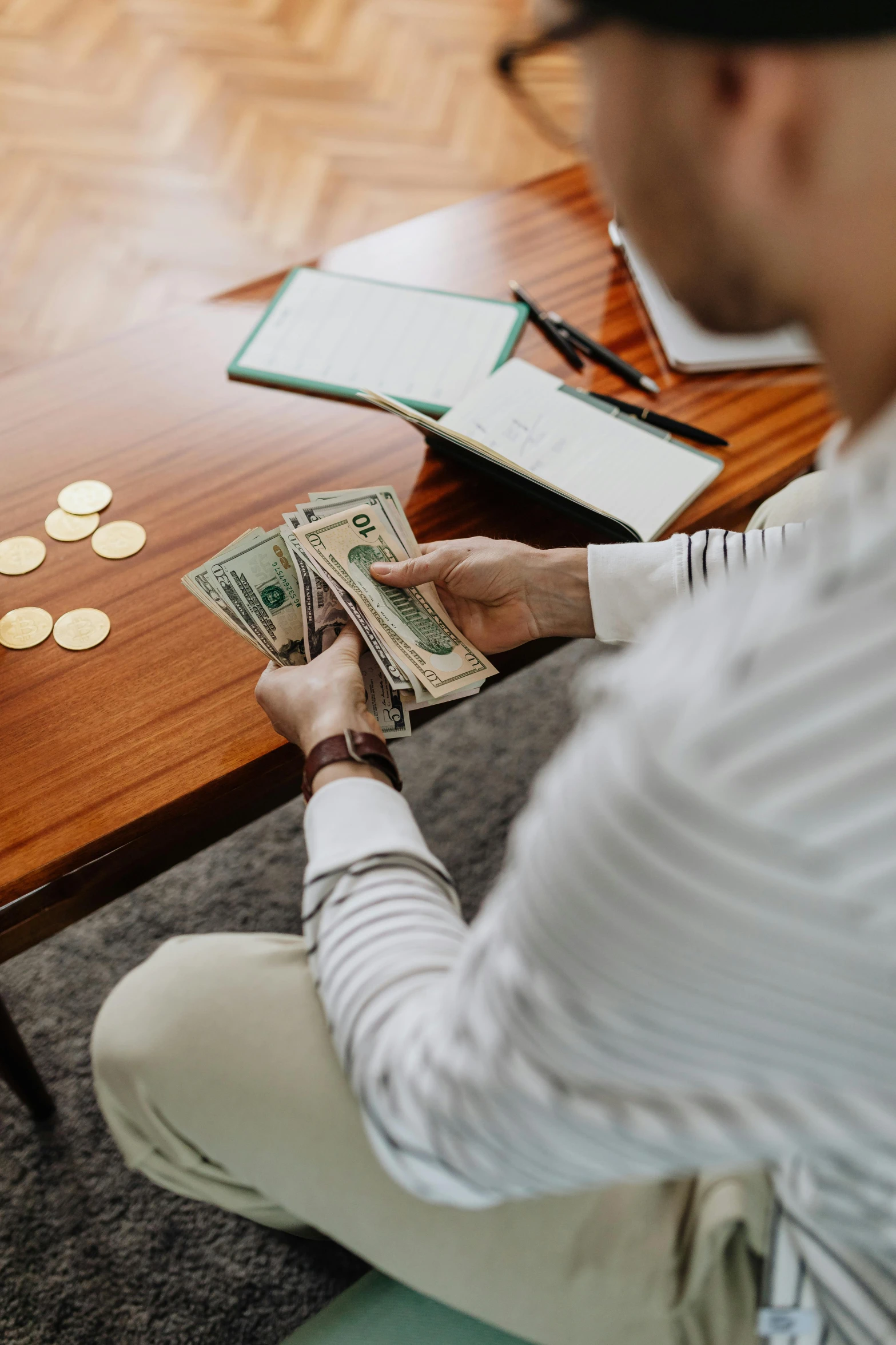 a man sitting at a table with stacks of money, pexels contest winner, 🤬 🤮 💕 🎀, instagram post, - 9, casually dressed