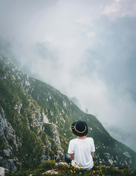 a person sitting on top of a mountain, on a cloudy day, trending photo, face looking skyward, mount olympus