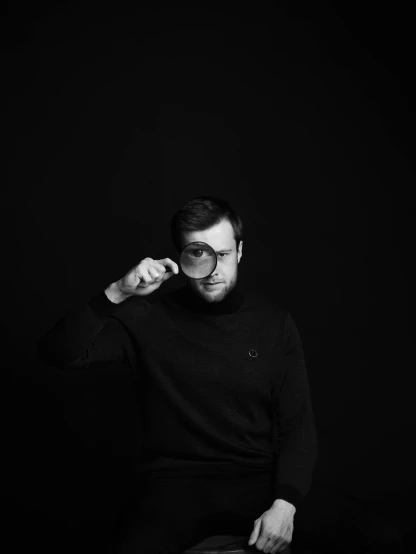 a black and white photo of a man with glasses, unsplash contest winner, minimalism, in a pitch black room, wearing turtleneck, anna nikonova, vantablack gi