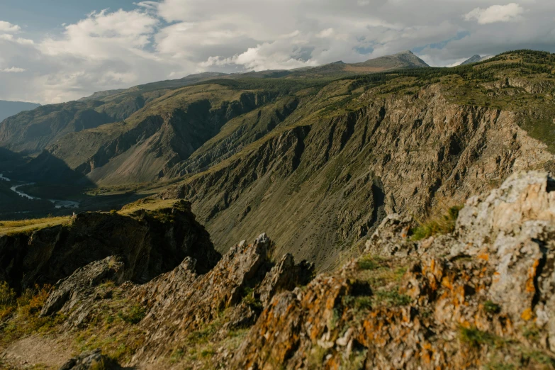 a person riding a snowboard on top of a mountain, pexels contest winner, hurufiyya, in between a gorge, gravel and scree ground, panorama, georgic