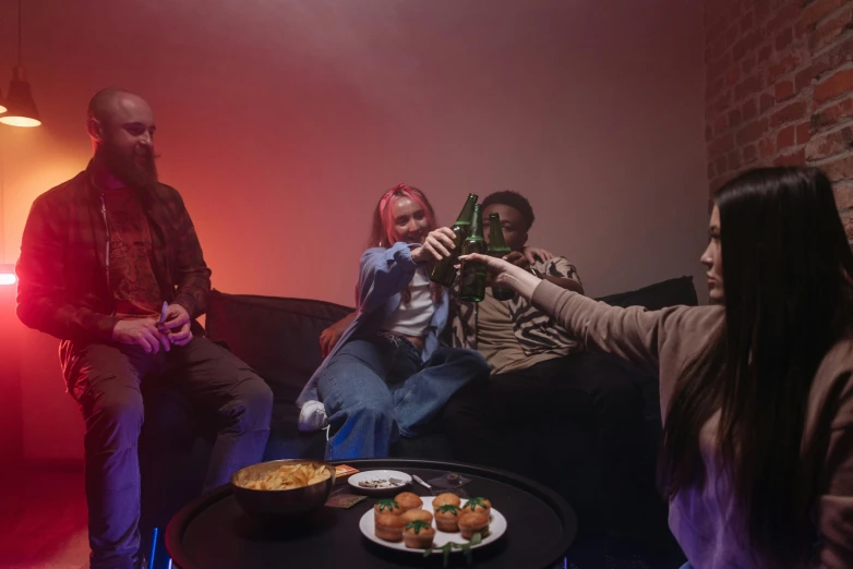 a group of people sitting around a table with drinks, red and cinematic lighting, coloured, on a couch, smokey room