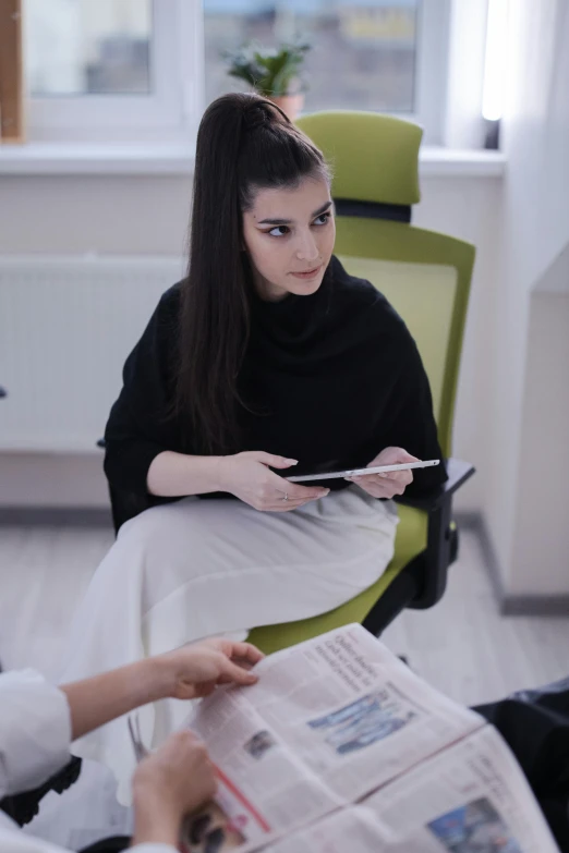 two women sitting at a table reading newspapers, a cartoon, by Adam Marczyński, pexels contest winner, female in office dress, pale-skinned persian girl, (doctor), sitting on designer chair