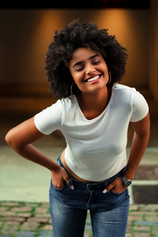 a woman standing next to a yellow fire hydrant, an album cover, by Nadir Afonso, pexels contest winner, renaissance, dark short curly hair smiling, crop top, black teenage girl, jeans and t shirt