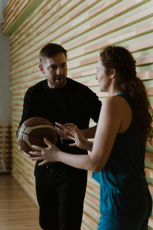 a man standing next to a woman holding a basketball, dribble, teaching, jovana rikalo, square, 15081959 21121991 01012000 4k