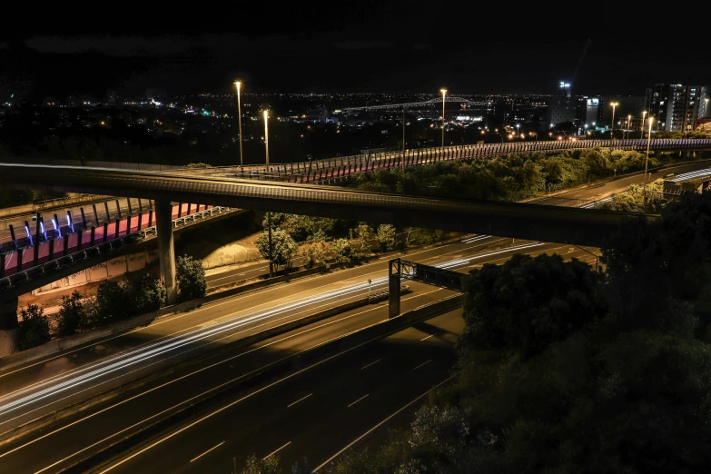 an aerial view of a highway at night, a matte painting, pexels contest winner, bridge, ilustration, composite, pathetic