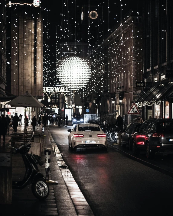 a city street filled with lots of lights, instagram picture, thumbnail, berlin city, glitter