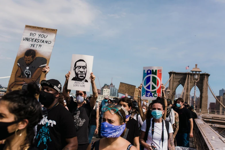 a group of people walking across a bridge, a cartoon, trending on unsplash, black arts movement, protesters holding placards, wearing facemask and sunglasses, ny, portrait photo