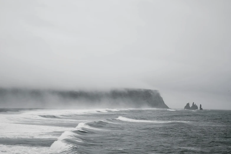 a black and white photo of the ocean, a black and white photo, pexels contest winner, grey mist, te pae, surf photography, cliffs