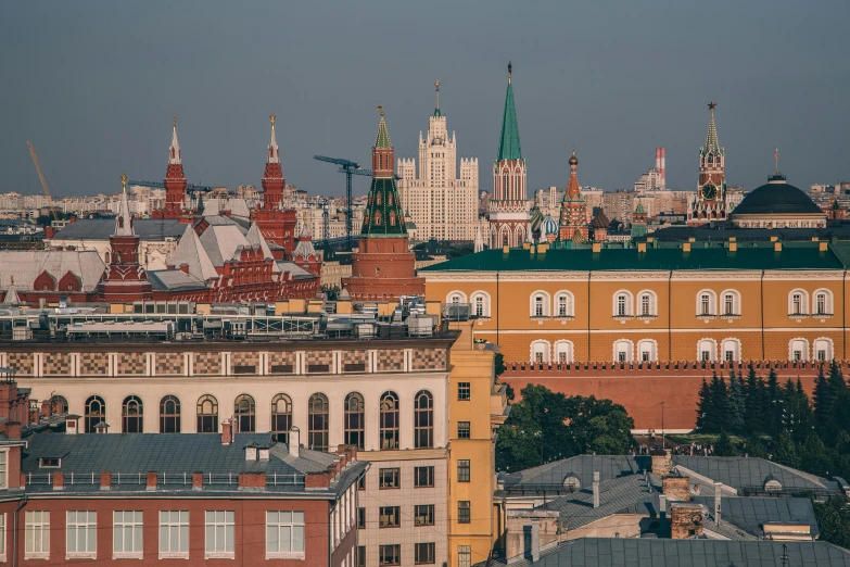 a view of a city from the top of a building, inspired by Vasily Surikov, pexels contest winner, kremlin, skyline view from a rooftop, three views, square