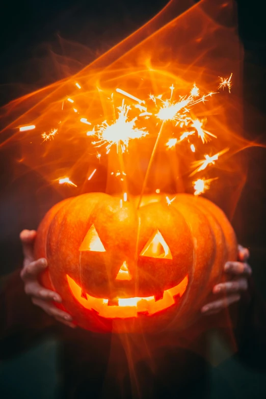 a person holding a glowing pumpkin in their hands, sparklers, jack - o'- lantern, promo image, super high resolution