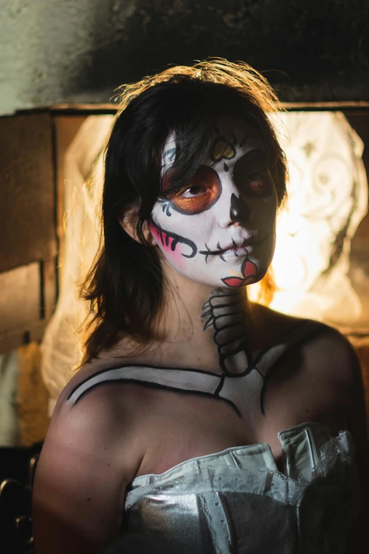 a woman with a skeleton painted on her face, lowbrow, with haunted eyes and dark hair, body and headshot, promo image, multi - coloured