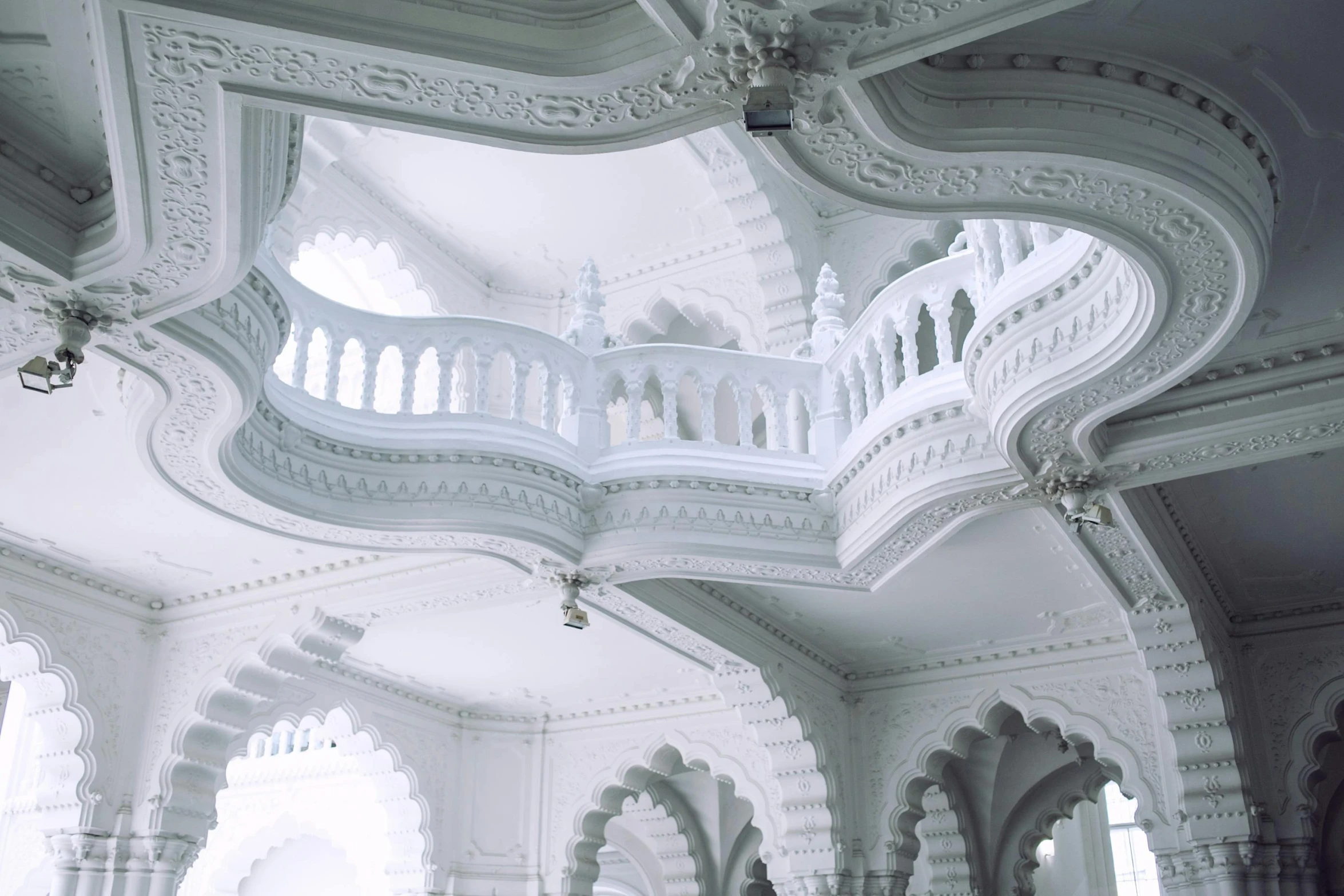 a couple of people that are standing in a building, inspired by Mihály Munkácsy, unsplash contest winner, rococo, indian temple, white pearlescent, pointed arches, detailed white