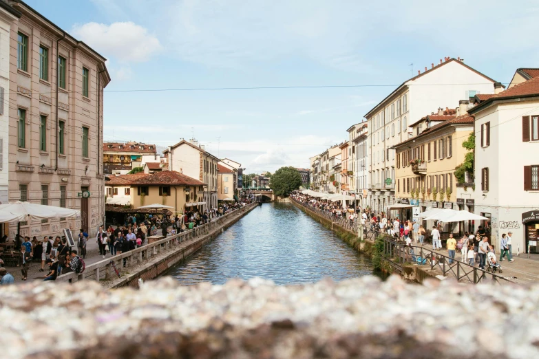 a river running through a city next to tall buildings, pexels contest winner, renaissance, venice biennale, people watching around, milan jozing, railing along the canal