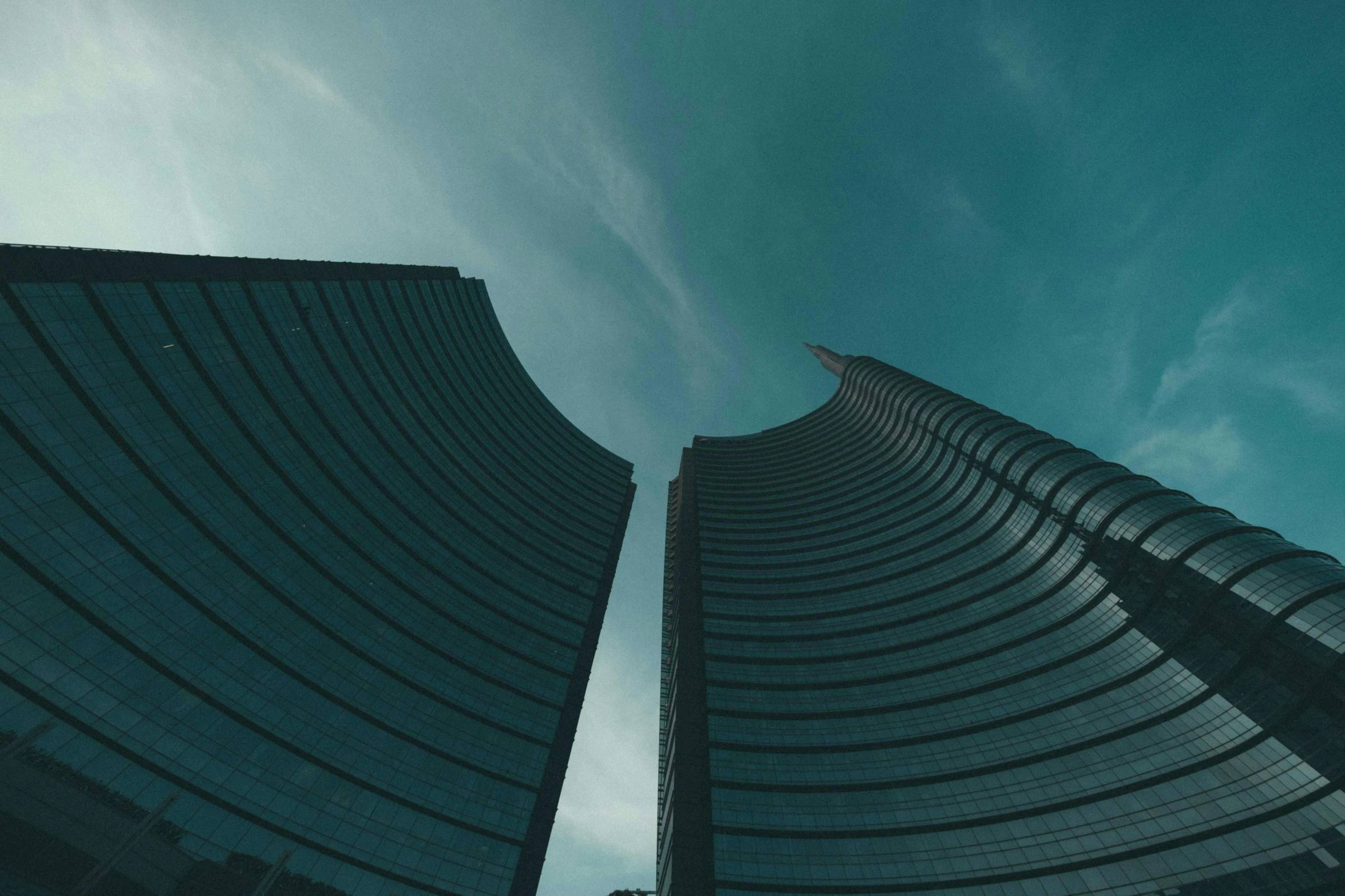 a couple of tall buildings next to each other, pexels contest winner, surrealism, milan jozing, corporate animation style, gopro photo, curvy build