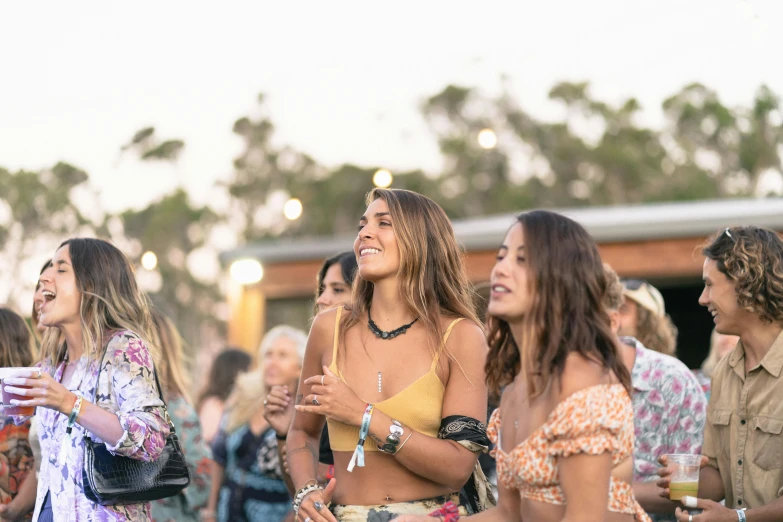 a group of women standing next to each other, trending on unsplash, happening, music festival, australian, hollister ranch, bangles