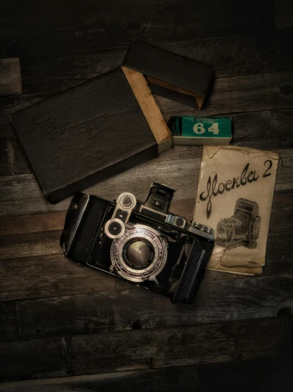 an old camera sitting on top of a wooden table, by andrei riabovitchev, pexels contest winner, photorealism, album cover, soviet, retro dark vintage, medium format