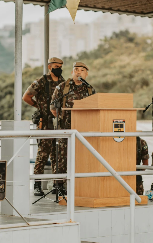 a group of men standing on top of a boat, giving a speech, wearing camo, taiwan, profile image