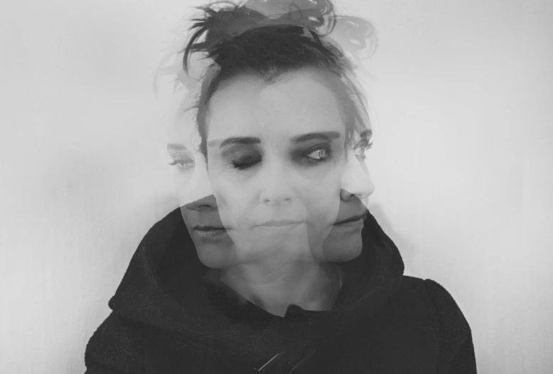 a black and white photo of a woman in a hoodie, a black and white photo, inspired by Anna Füssli, serial art, with the face of emma watson, stable diffusion self portrait, hud face, winona ryder