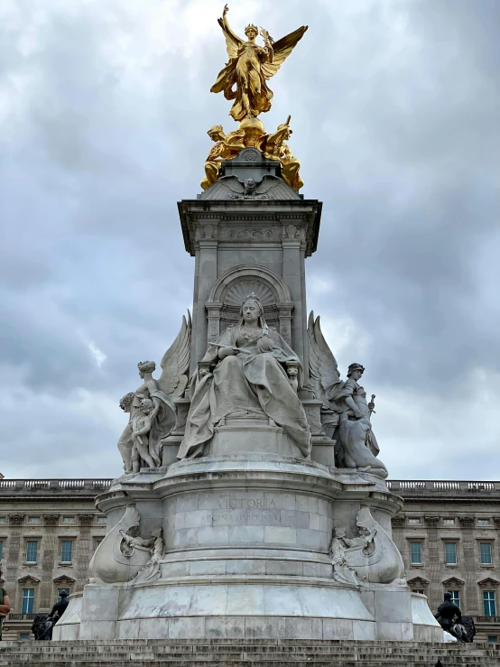 a statue of an angel on top of a building, queen victoria, featuring marble fountains, photo from 2022, the panorama