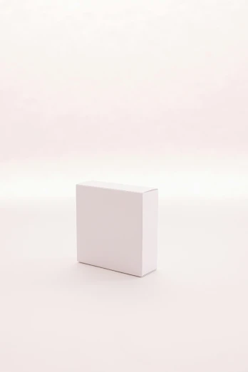 a white box sitting on top of a white surface, a picture, unsplash, in front of white back drop, gif, single, pink