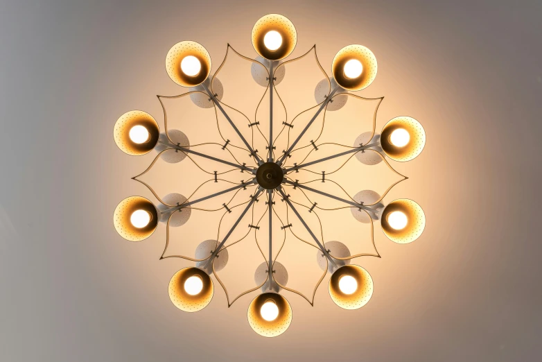 a close up of a light fixture in a room, inspired by Graham Forsythe, unsplash, conceptual art, symmetrical crown, multi-part, top down lighting, midcentury modern
