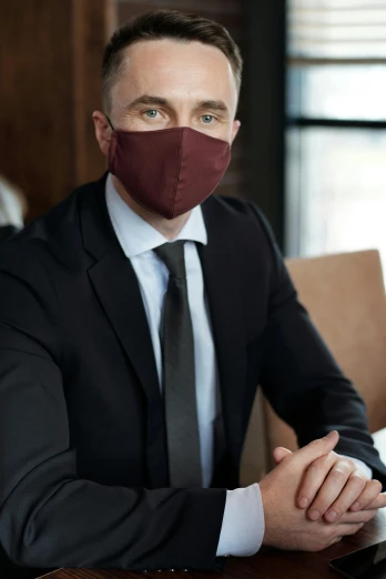 a man in a suit and tie wearing a face mask, renaissance, maroon, lifestyle, ready for a meeting, premium