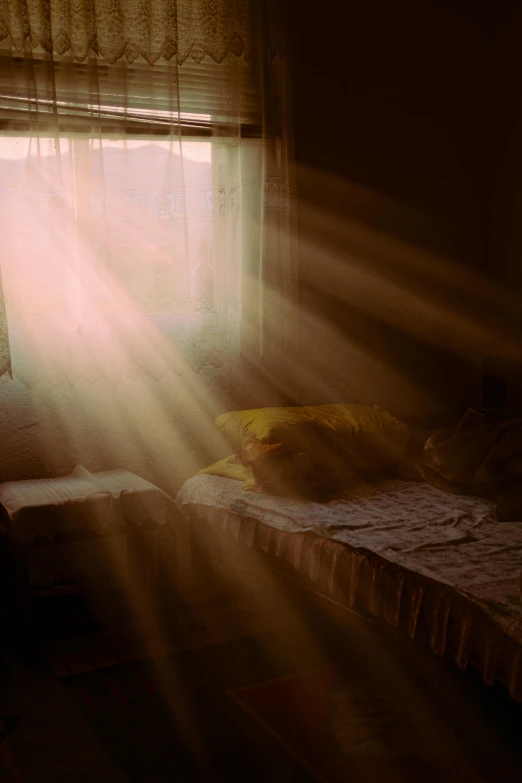 a bed sitting in a bedroom next to a window, a picture, pexels contest winner, light and space, shafts of light god rays, paul barson, golden morning light, waking up