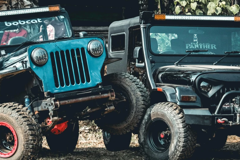 a couple of jeeps parked next to each other, a portrait, unsplash, assamese aesthetic, square, blue-black, 15081959 21121991 01012000 4k