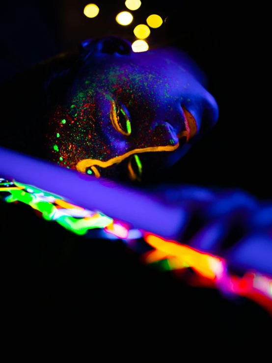 a close up of a person holding a knife, by Julia Pishtar, pexels contest winner, process art, glow sticks, day - glow facepaint, neon ligh, profile pic