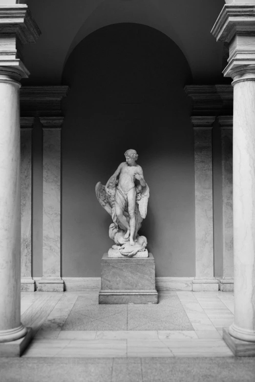a black and white photo of a statue in a building, neoclassicism, metmuseum, monochrome:-2, colonnade, indoor picture