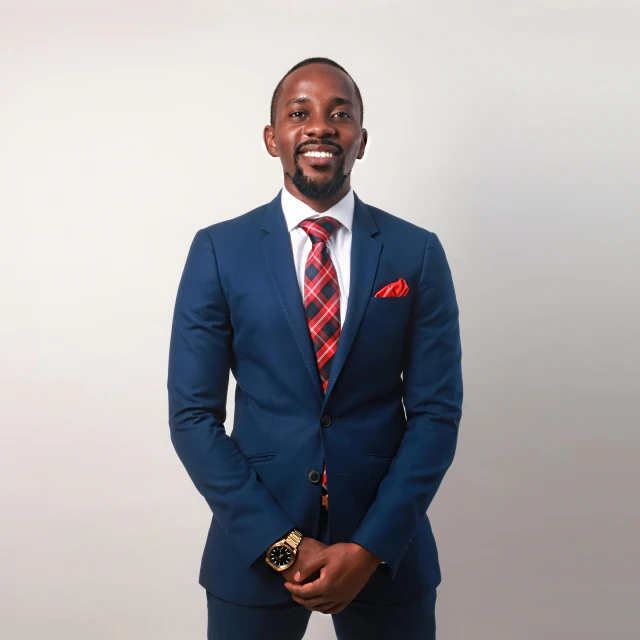 a man in a blue suit and red tie, by Chinwe Chukwuogo-Roy, pexels contest winner, full body and head shot, instagram post, ceo, mkbhd