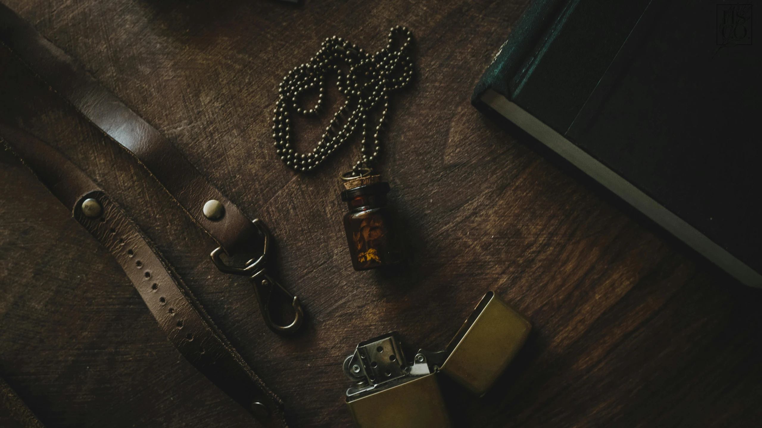 a bunch of items that are on a table, by Elsa Bleda, trending on pexels, whiskey bottle, pendants, brown, adventure gear
