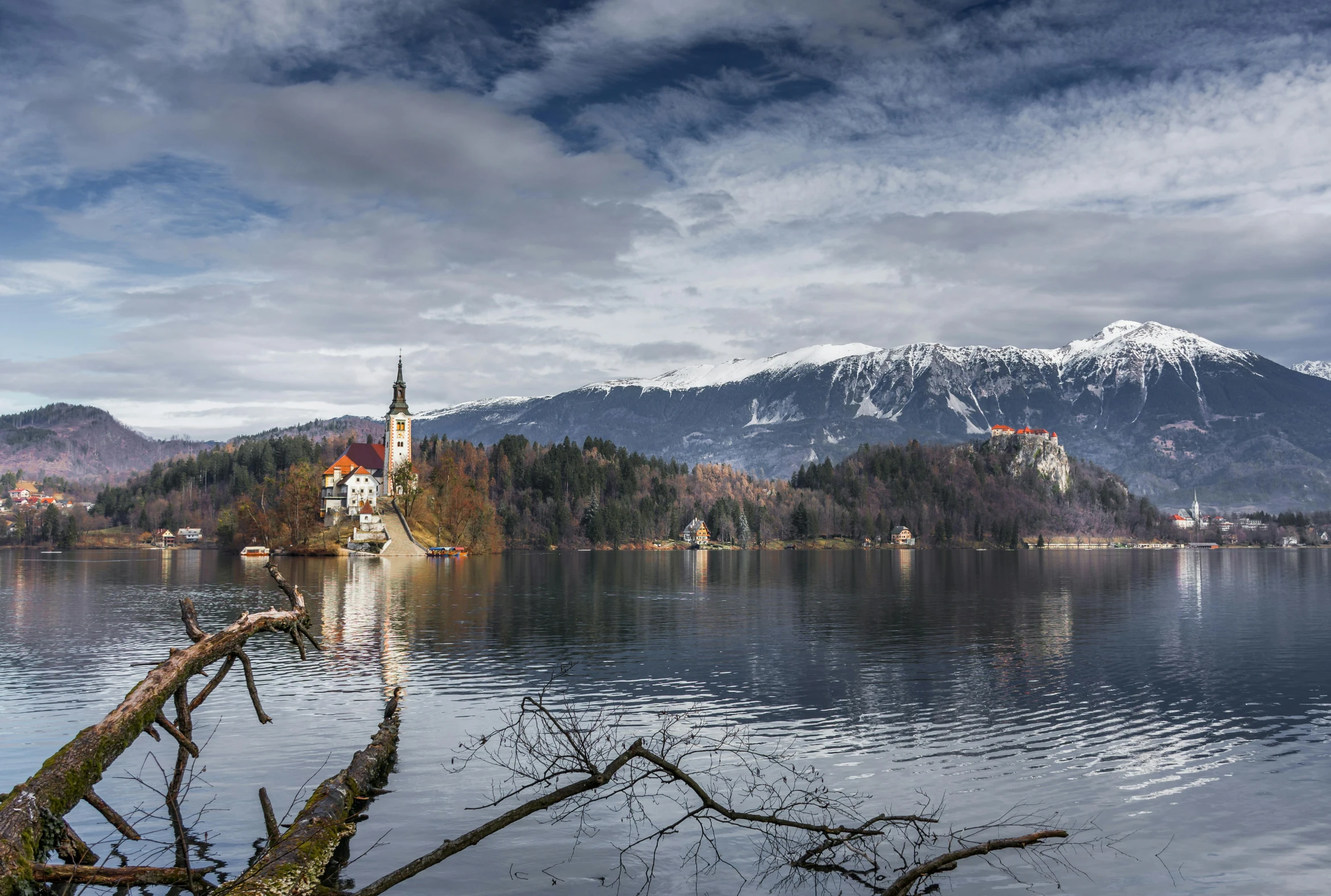 a large body of water with mountains in the background, by Sebastian Spreng, pexels contest winner, romanticism, church in the background, jeszika le vye, lakes, panoramic