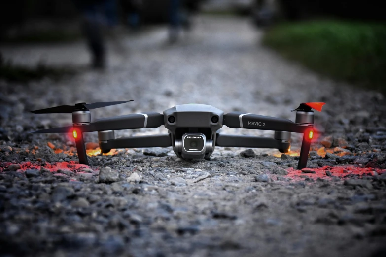 a black drone sitting on top of a gravel road, pexels, photorealism, landing lights, instagram post, 2 d cg, dof 8 k