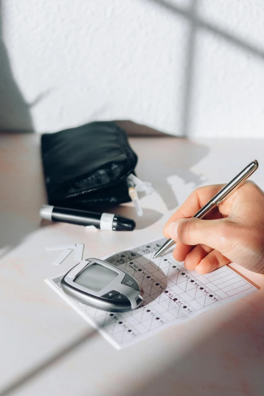 a person sitting at a table writing on a piece of paper, diagnostics, flatlay, thumbnail, unbeatable quality