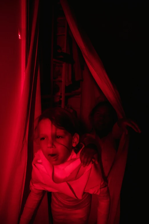 a little girl standing in front of a red light, tickle fight in the death tent, slide show, haunted spaceship hallway, profile image