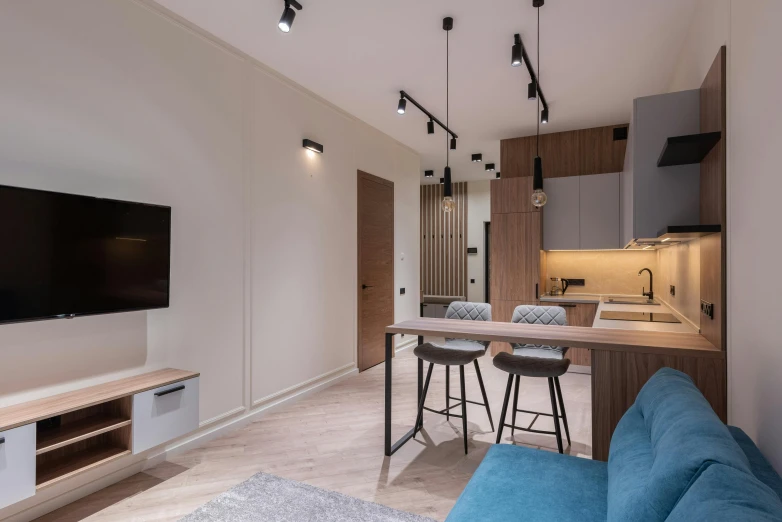 a living room filled with furniture and a flat screen tv, unsplash contest winner, light and space, small kitchen, neo kyiv, electrical, high quality photo