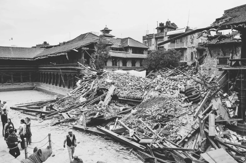 a black and white photo of a pile of rubble, shin hanga, nepali architecture buildings, with a long, flood, a huge