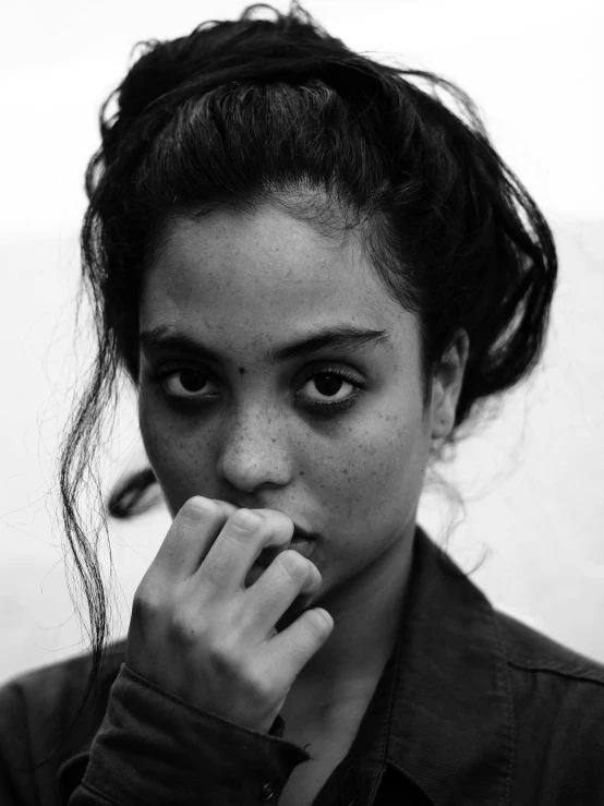 a black and white photo of a woman, by irakli nadar, aida muluneh, lovingly looking at camera, square, with a hurt expression