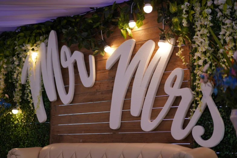 there is a sign that says no mess on the wall, by Gwen Barnard, unsplash, wedding photo, covered outdoor stage, high angle close up shot, white panels
