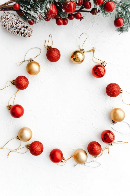 a wreath made of red and gold ornaments, pexels, process art, on a white table, monochromatic, round-cropped, full product shot