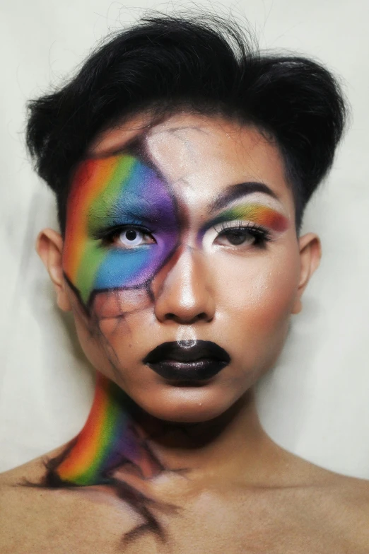 a woman with a rainbow painted on her face, an album cover, inspired by Taro Yamamoto, trending on pexels, androgynous male, cracked, dark skinned, → ⃣ spectrum darkness prime