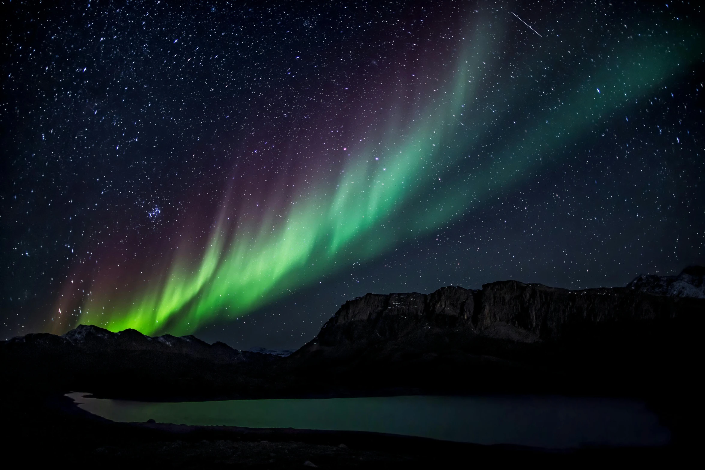 the aurora bore over a lake with mountains in the background, an album cover, pexels contest winner, hurufiyya, multicoloured, black, mikko lagerstedt, banff national park