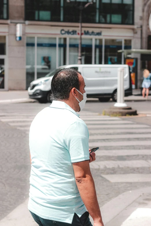 a man walking across a street while wearing a face mask, trending on pexels, square, gui guimaraes, looking distracted, belgium